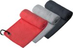 Three Handy Picks 16x16 inch microfiber golf towels in black, grey, and red, with attached carabiner clips, neatly folded.