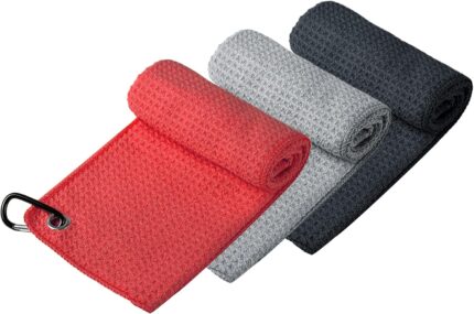 Three Handy Picks 16x16 inch microfiber golf towels in black, grey, and red, with attached carabiner clips, neatly folded.