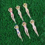 A set of six KOFULL novelty golf tees in various bright colors and humorous shapes, packaged in a gift box.